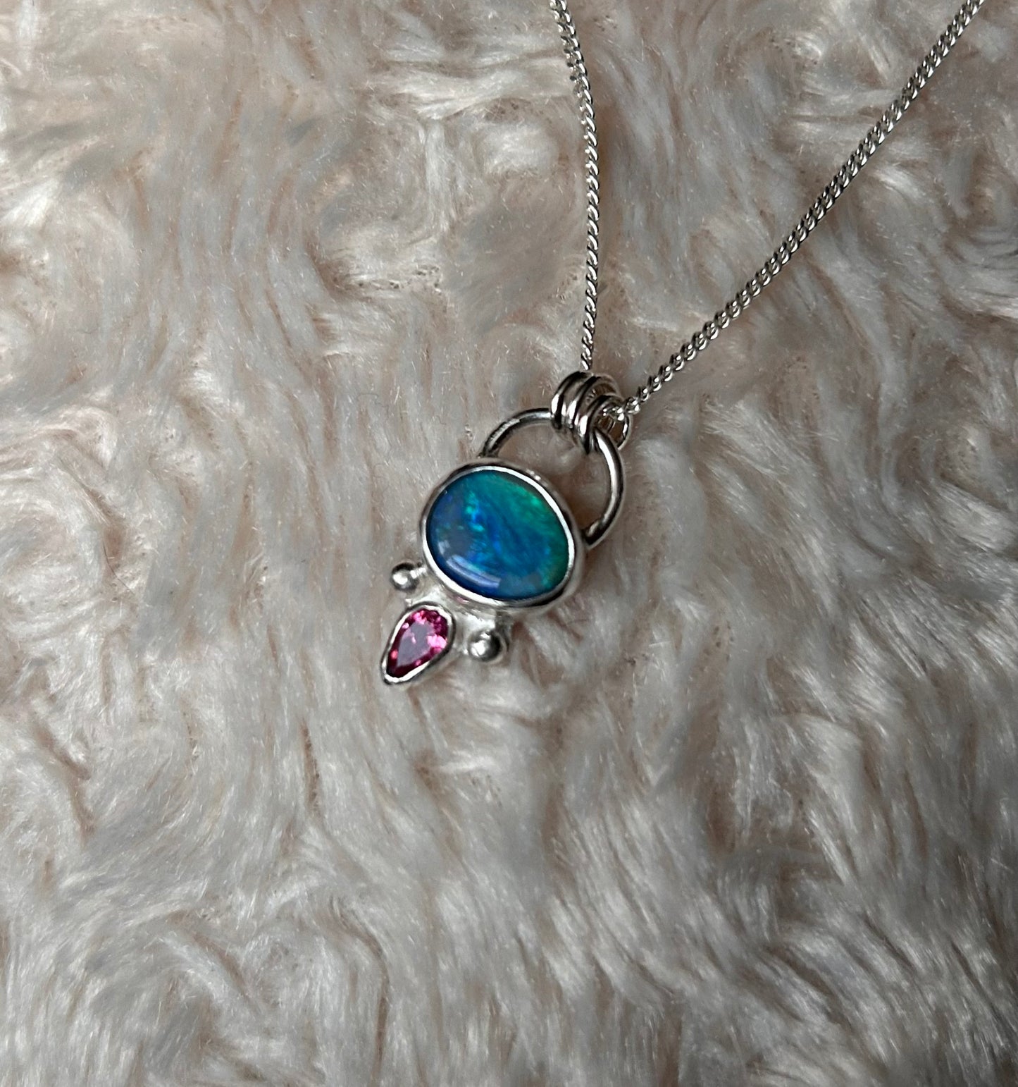 Opal and tourmaline pendant available