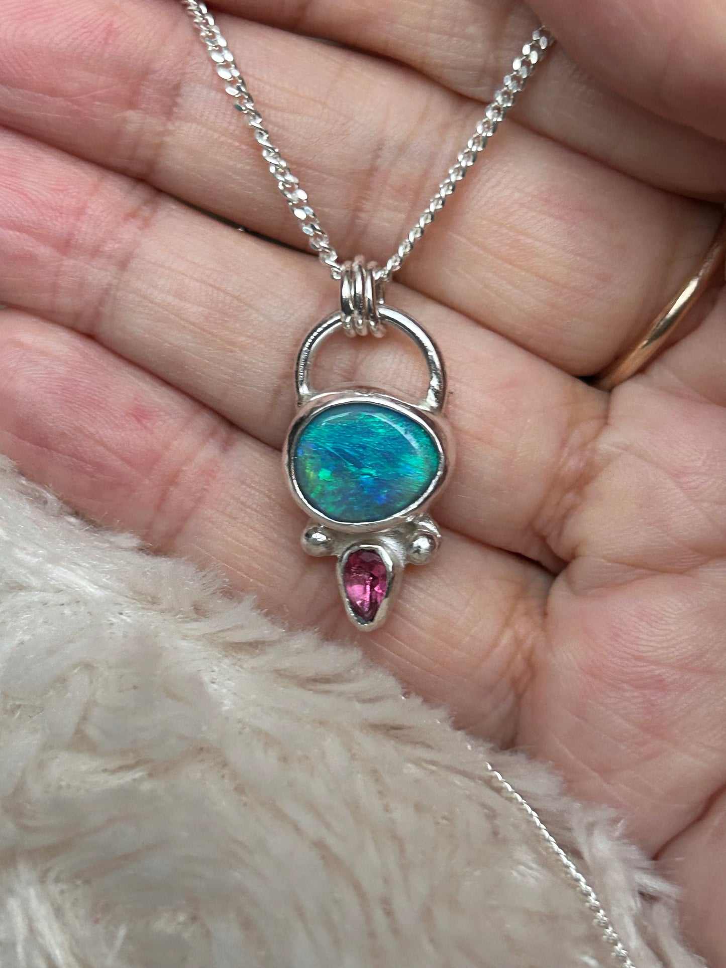 Opal and tourmaline pendant available