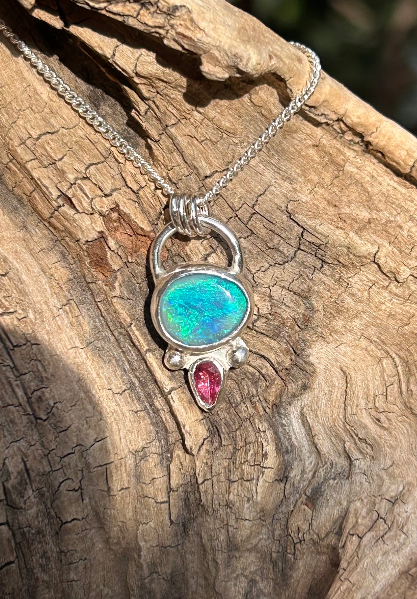 Opal and tourmaline pendant available