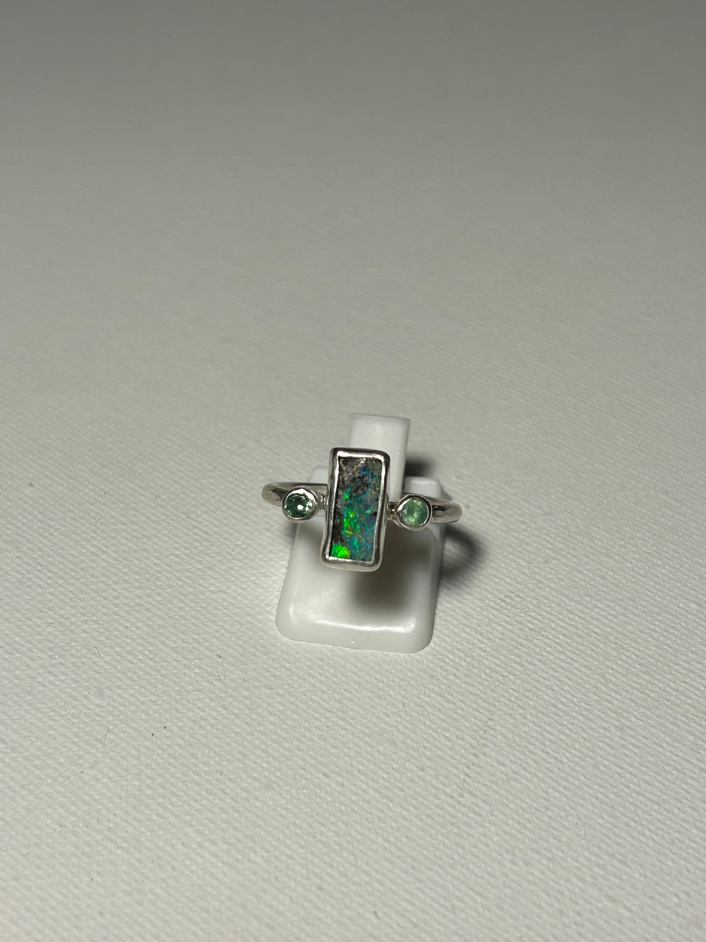 Green trilogy ring