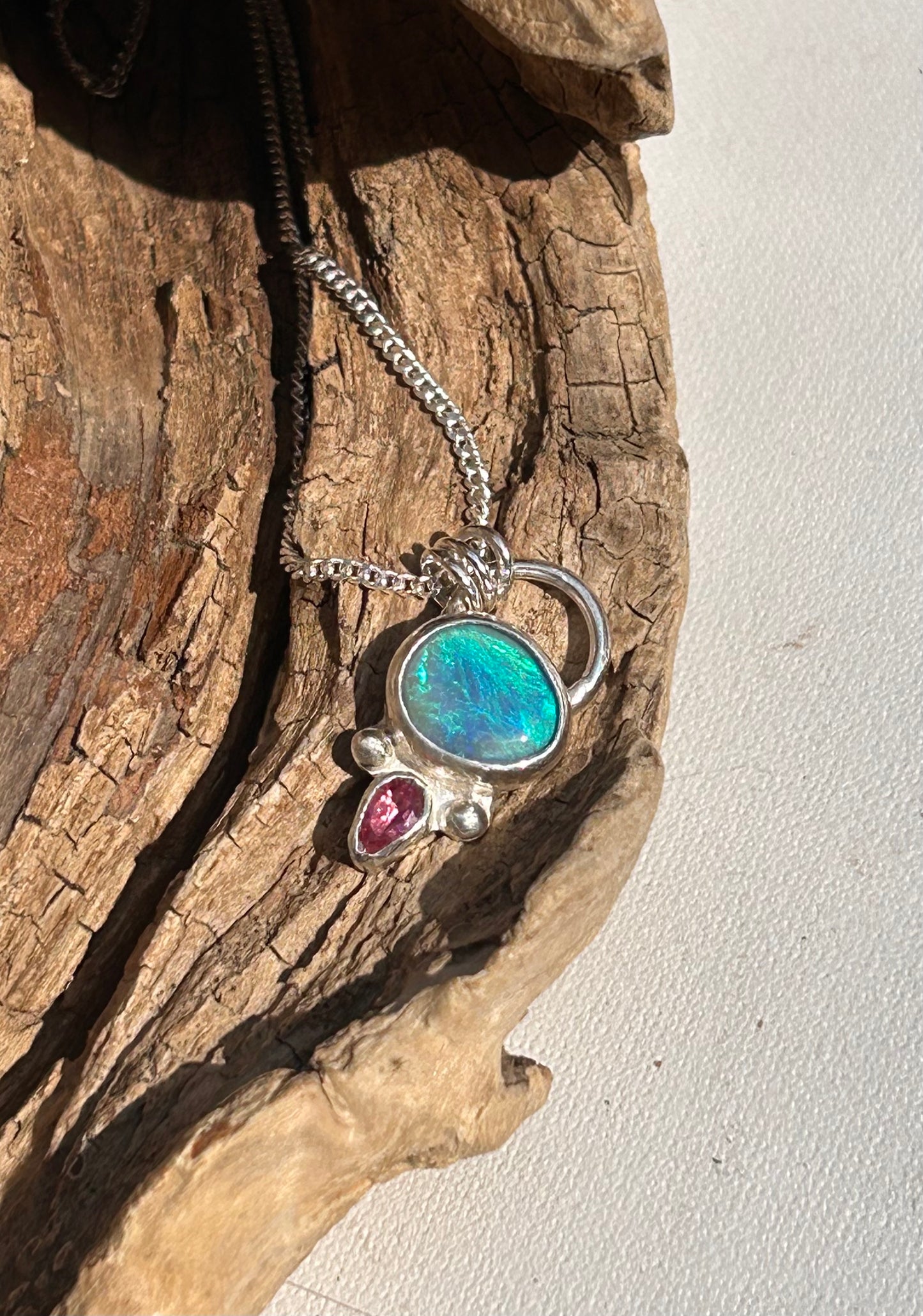 Opal and tourmaline pendant available